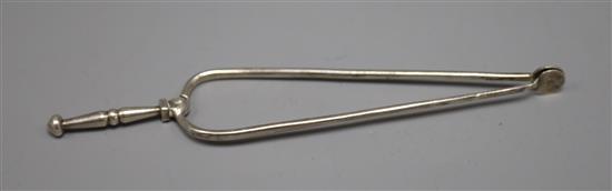 A pair of Dutch white metal sugar tongs, 16cm.